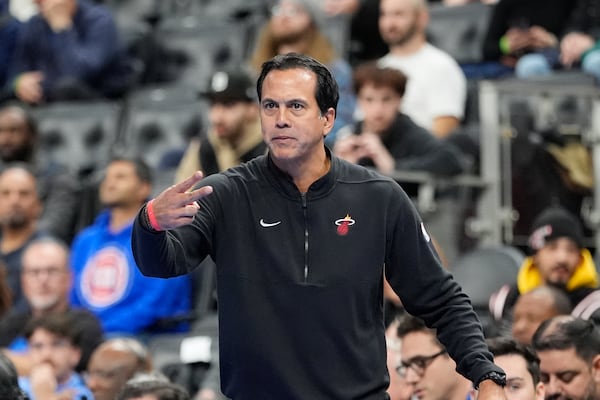 Miami Heat head coach Erik Spoelstra signals from the sideline during the first half of an Emirates NBA Cup basketball game against the Detroit Pistons, Tuesday, Nov. 12, 2024, in Detroit. (AP Photo/Carlos Osorio)