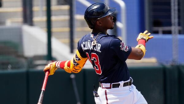 Atlanta Braves' Ronald Acuna (13) follows through on a solo-home run in the third inning against the Boston Red Sox Tuesday, March 23, 2021, at CoolToday Park in North Port, Fla. (John Bazemore/AP)