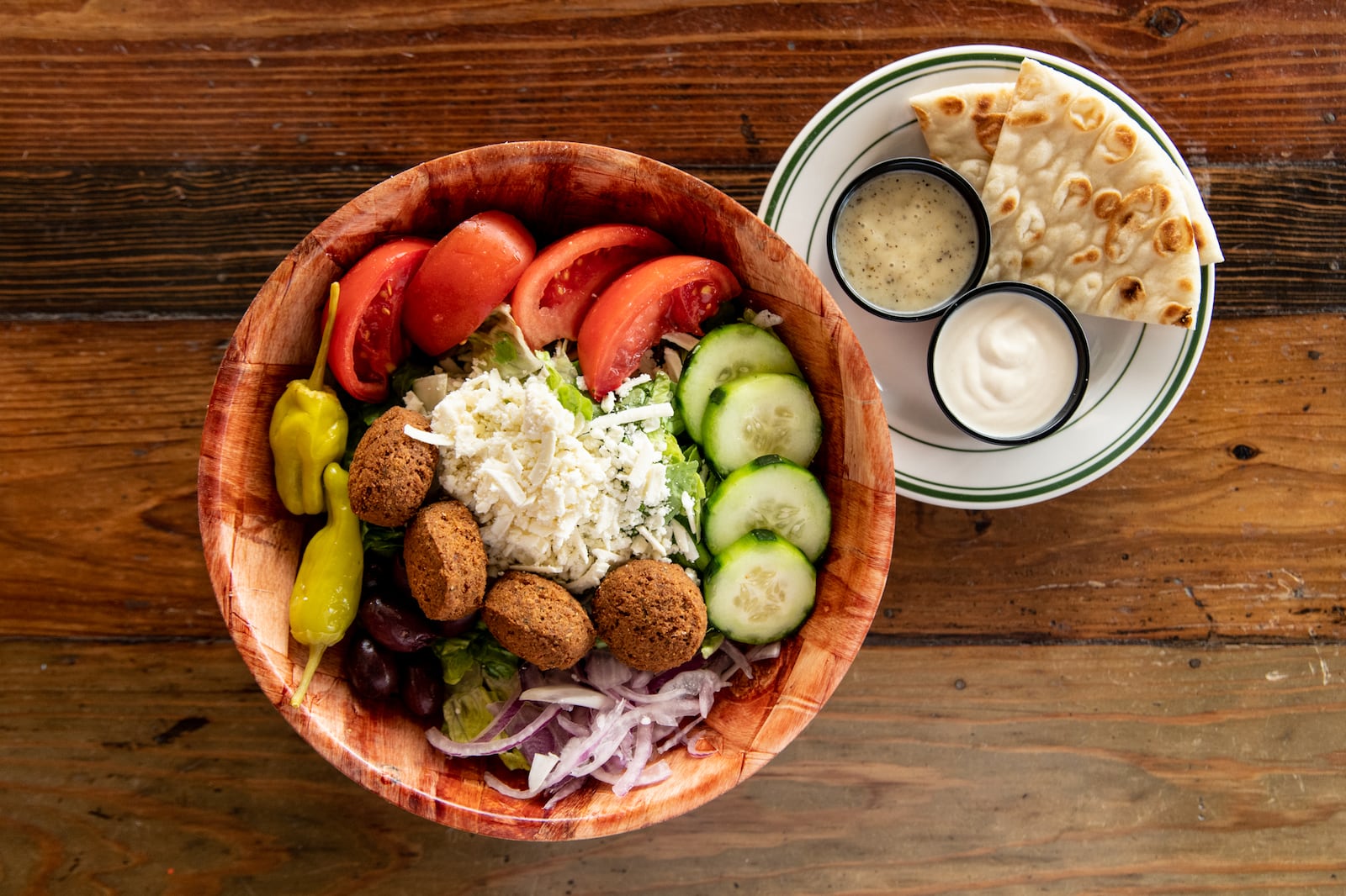 The Greek Pizzeria and Gyros Greek Salad with added falafel. (Mia Yakel for The Atlanta Journal-Constitution)