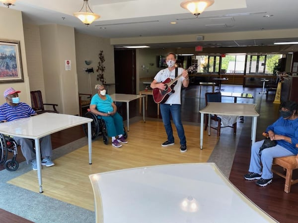 Music Therapist, John Abel, leading a music therapy session at A.G. Rhodes nursing home in Atlanta during the coronavirus pandemic.