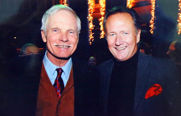 100813 Atlanta: This is a photo of Bill Tush with Ted Turner titled "2009 Captain Planet Christmas Party" he has meticulously chronicled as part of his life in scrapbooks as seen on Tuesday, Oct. 8, 2013, in Atlanta.   CURTIS COMPTON /staff  CCOMPTON@AJC.COM