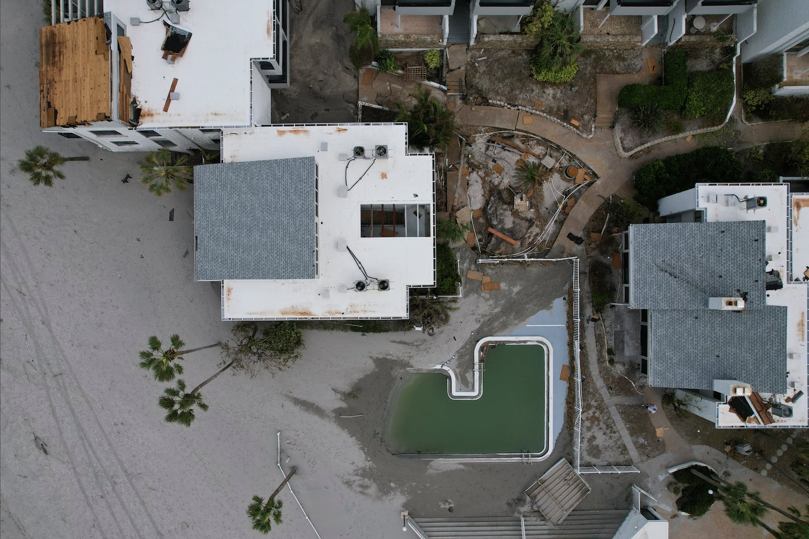 Hurricane Milton damage is seen to the beachfront condominium community of Bahia Vista Gulf, on the island of Venice, Fla., Friday, Oct. 11, 2024. (AP Photo/Rebecca Blackwell)