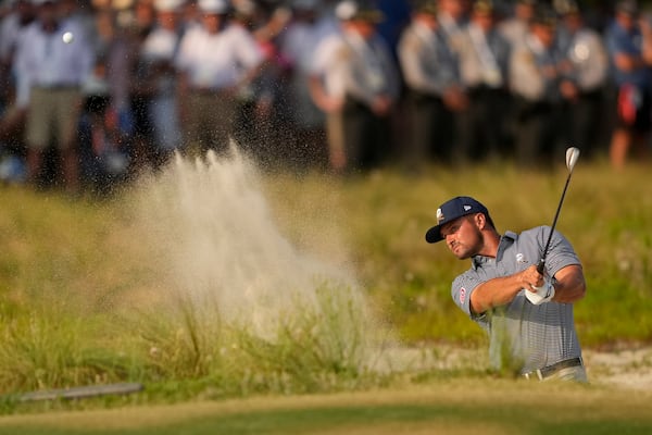 FILE - Bryson DeChambeau hits from the bunker on the 18th hole during the final round of the U.S. Open golf tournament Sunday, June 16, 2024, in Pinehurst, N.C. (AP Photo/Matt York, File)