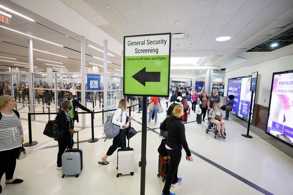 Travelers pass through TSA security lines at the Hartsfield-Jackson Atlanta International Airport on Monday, May 22, 2023. The airport’s current forecast shows it could handle 2.1 million passengers from Thursday, May 25, through Wednesday, May 31. 

Miguel Martinez /miguel.martinezjimenez@ajc.com