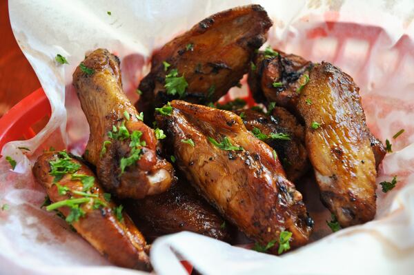 Smoke 'Em If Ya Got 'Em- 48 hour marinated wings, slow smoked, double dipped or naked from Bone Lick BBQ.