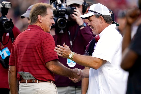 Happier times: Alabama head coach Nick Saban, left, and Texas A&M head coach Jimbo Fisher, right, shake hands during pre-game of an NCAA college football game on Saturday, Oct. 9, 2021, in College Station, Texas. (AP Photo/Sam Craft)