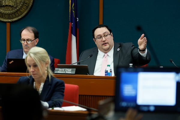 David Emadi, the executive director of the State Ethics Commission, points at the screen during his presentation at the Ethics Commission meeting held at the Coverdell Legislative Office Building on Wednesday, January 15. A voting rights group founded by Stacey Abrams will pay $300,000 for unlawfully supporting her 2018 gubernatorial campaign.
(Miguel Martinez/AJC)