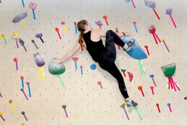 Rachel Chalik climbs a boulder problem at Philadelphia Rock Gym in Wyncote, Pa., on Wednesday, July 31, 2024. (AP Photo/Jonathan Elderfield)