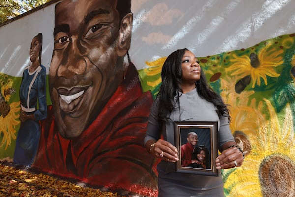 Monteria Robinson, the mother of Jamarion Robinson, poses in front of a mural  in 2021 dedicated to her son’s memory. Today, Robinson points to the death of Nygil Cullins, 22, who was shot and killed by Atlanta Police last week  as evidence police methods have not improved when dealing with people experiencing mental issues.  Miguel Martinez for The Atlanta Journal-Constitution 