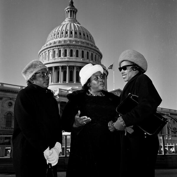 Three Mississippi women, denied the right to go onto the House floor at the opening of the new Congress, pose Jan. 4, 1965, outside the Capitol. From left: Annie Devine, Fannie Lou Hamer and Victoria Gray. They are contesting the election of three Mississippi representatives. "You have no floor privileges," Capitol police chief Carl Schamp told them. (AP Photo/Dick Strobel)