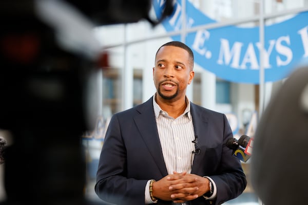 Benjamin E. Mays High School Principal Ramon Garner answers questions from members of the press addressing the incident that resulted in four students with gunshot wounds after dismissal Wednesday. (Miguel Martinez /miguel.martinezjimenez@ajc.com)