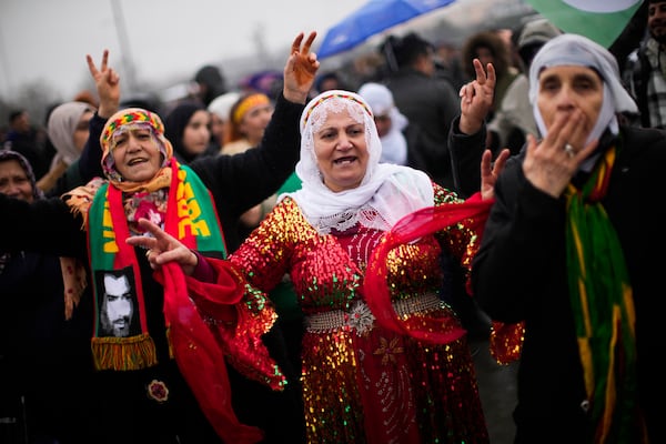 FILE - Kurdish women dance during the Newroz celebrations marking the start of spring in Istanbul, Turkey, Sunday, March 19, 2023. (AP Photo/Francisco Seco, File)