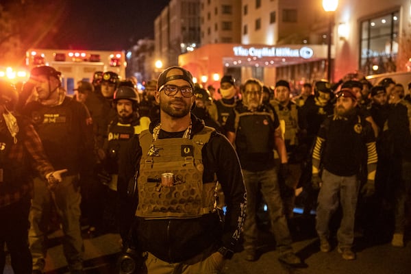 Enrique Tarrio, leader of the Proud Boys, leads a contingent of the group in Washington, Dec. 12, 2020. (Victor J. Blue/The New York Times)