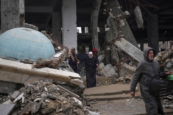 Palestinians leave after attending the first Friday prayers of the Muslim holy month of Ramadan at the Imam Shafi'i Mosque, damaged by Israeli army strikes, in the Zeitoun neighborhood in Gaza City, Friday March 7, 2025.(AP Photo/(AP Photo/Jehad Alshrafi)