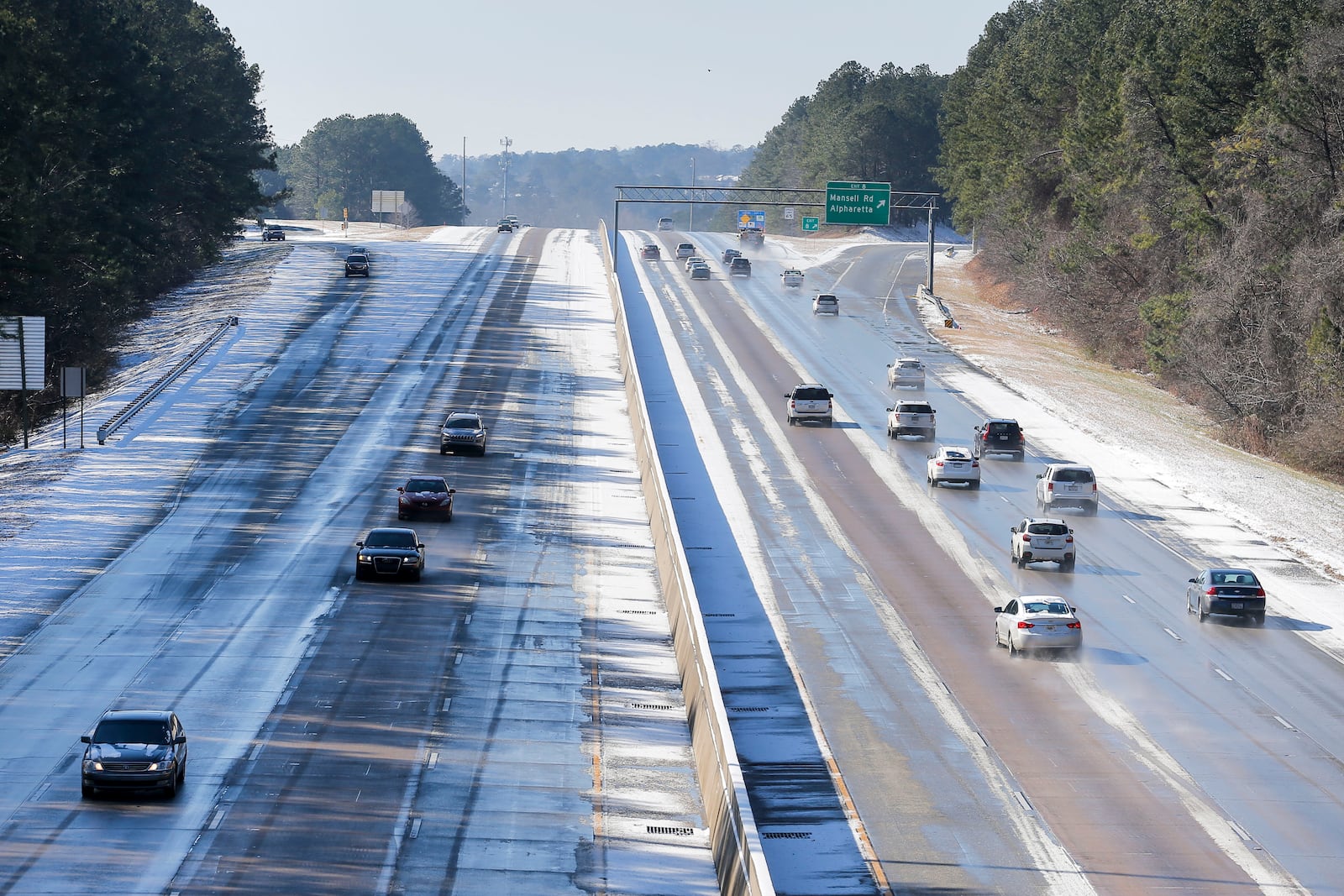 Cars travel along GA 400 in Alpharetta, Wednesday, January 17, 2018. 