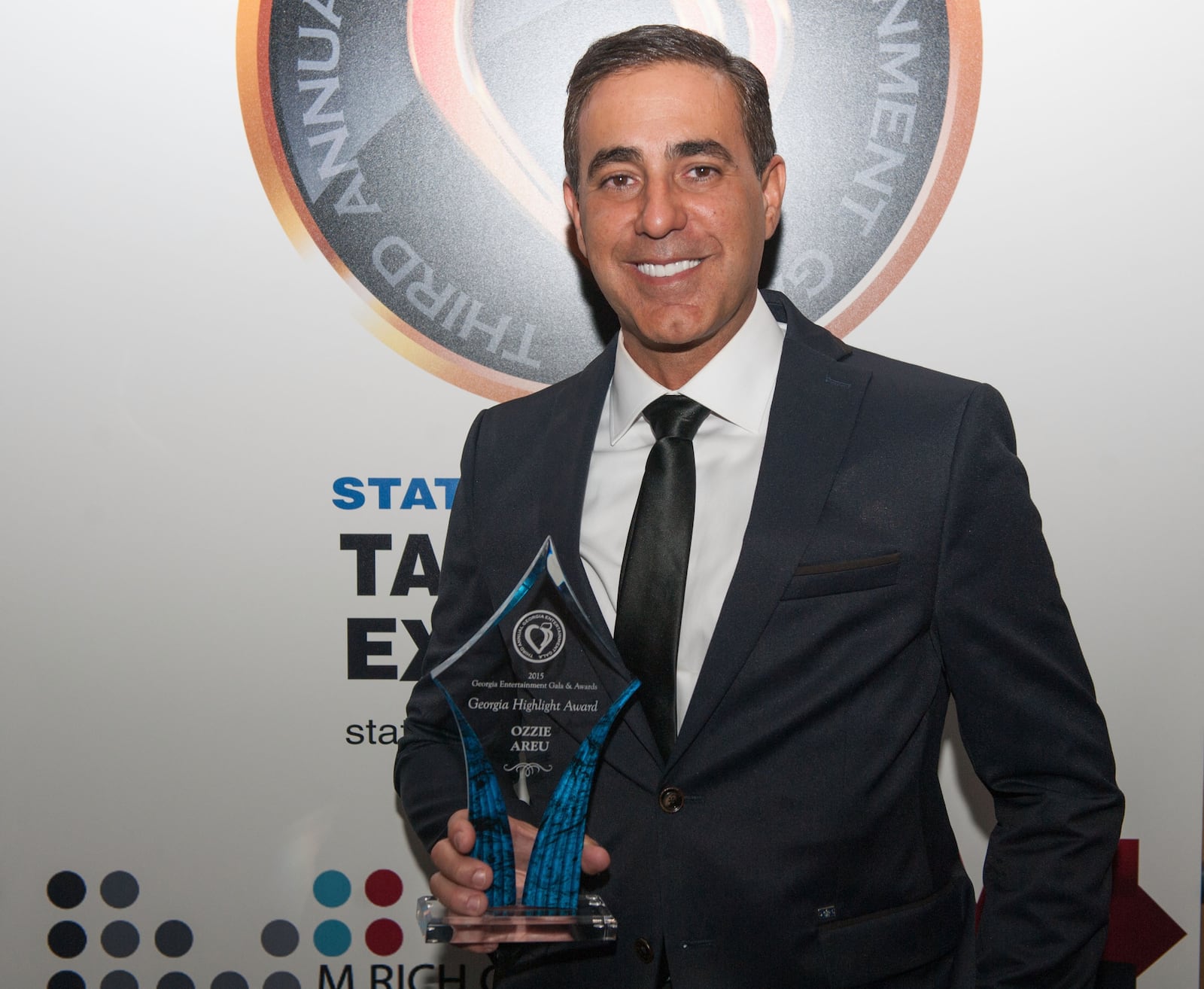 ATLANTA, GA - JANUARY 10:  Ozzie Areu receives the "Georgia Highlight" award during the 3rd Annual Georgia Entertainment Gala at Georgia World Congress Center on January 10, 2015 in Atlanta, Georgia.  (Photo by Marcus Ingram/Getty Images)