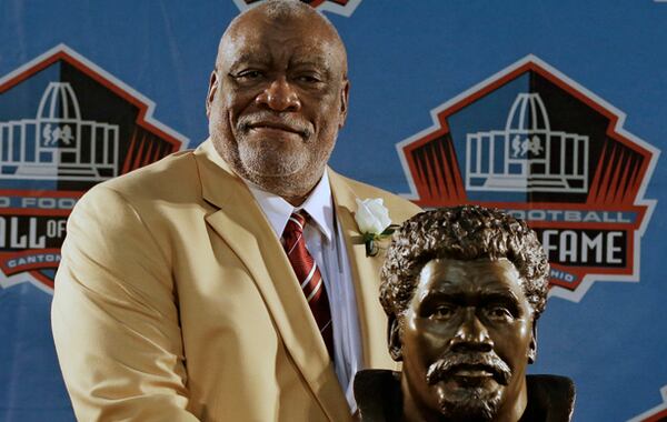 Hall of Fame Inductee Claude Humphrey poses with his bust during the 2014 Pro Football Hall of Fame Enshrinement Ceremony at the Pro Football Hall of Fame Saturday, Aug. 2, 2014, in Canton, Ohio. (AP Photo/Tony Dejak)