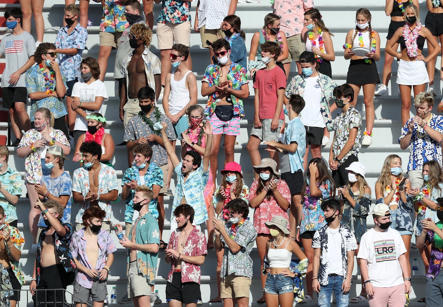 Cherokee high school students react after a field goal in the first half of the Cherokee game against Carver-Atlanta at Cherokee at Cherokee high school Wednesday, September 2, 2020 in Canton, Ga.. JASON GETZ FOR THE ATLANTA JOURNAL-CONSTITUTION