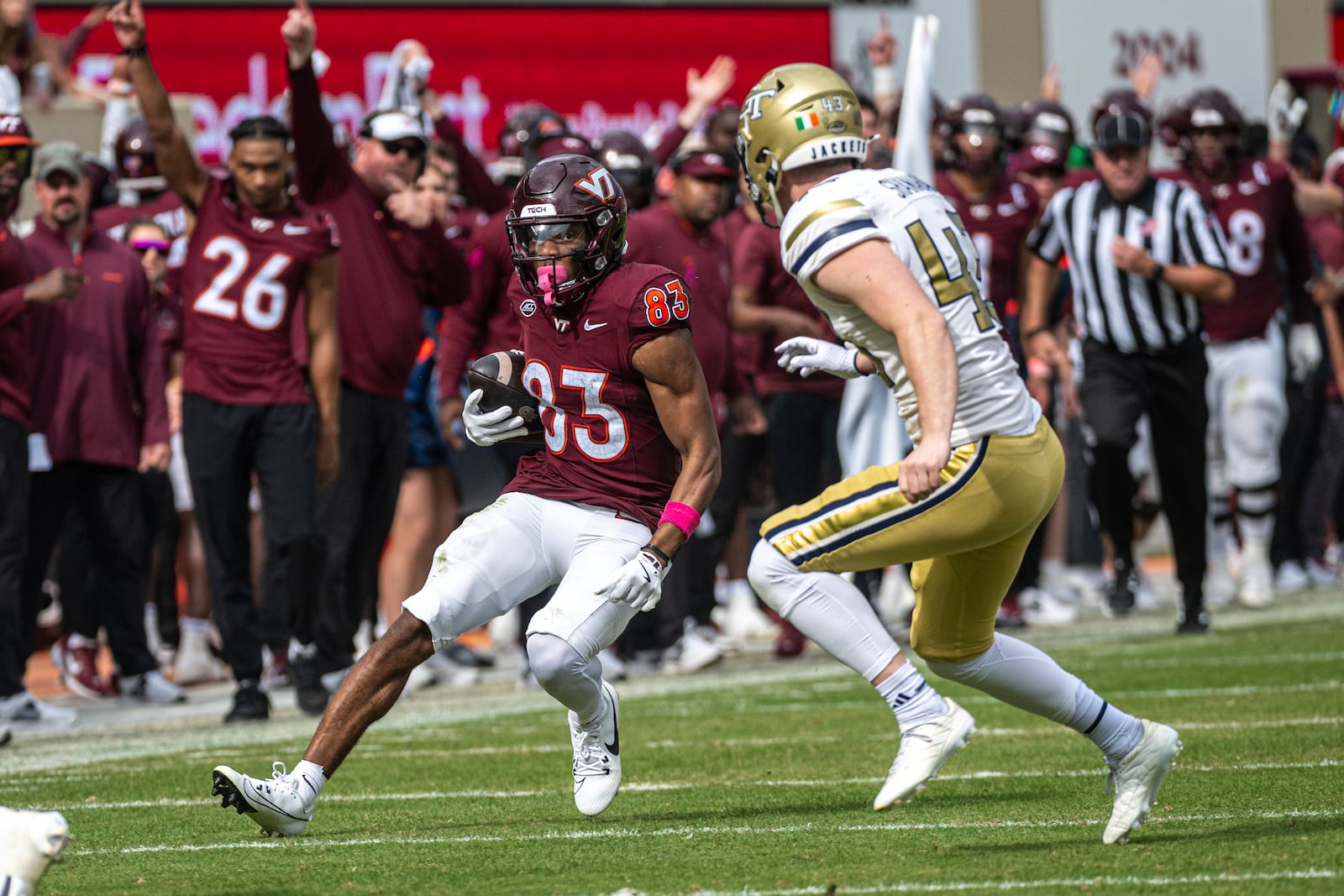 Virginia Tech's Jaylin Lane (83) runs by Georgia Tech's David Shanahan during the second half of an NCAA college football game, Saturday, Oct. 26, 2024, in Blacksburg, Va. (AP Photo/Robert Simmons)