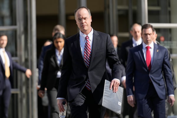 U.S. Attorney John Durham, center front, walks over to at a news conference outside the federal courthouse in the Brooklyn borough of New York, Friday, Feb. 28, 2025, following the arraignment of Cartel leaders Rafael Caro Quintero and Vicente Carrillo Fuentes. (AP Photo/Seth Wenig)