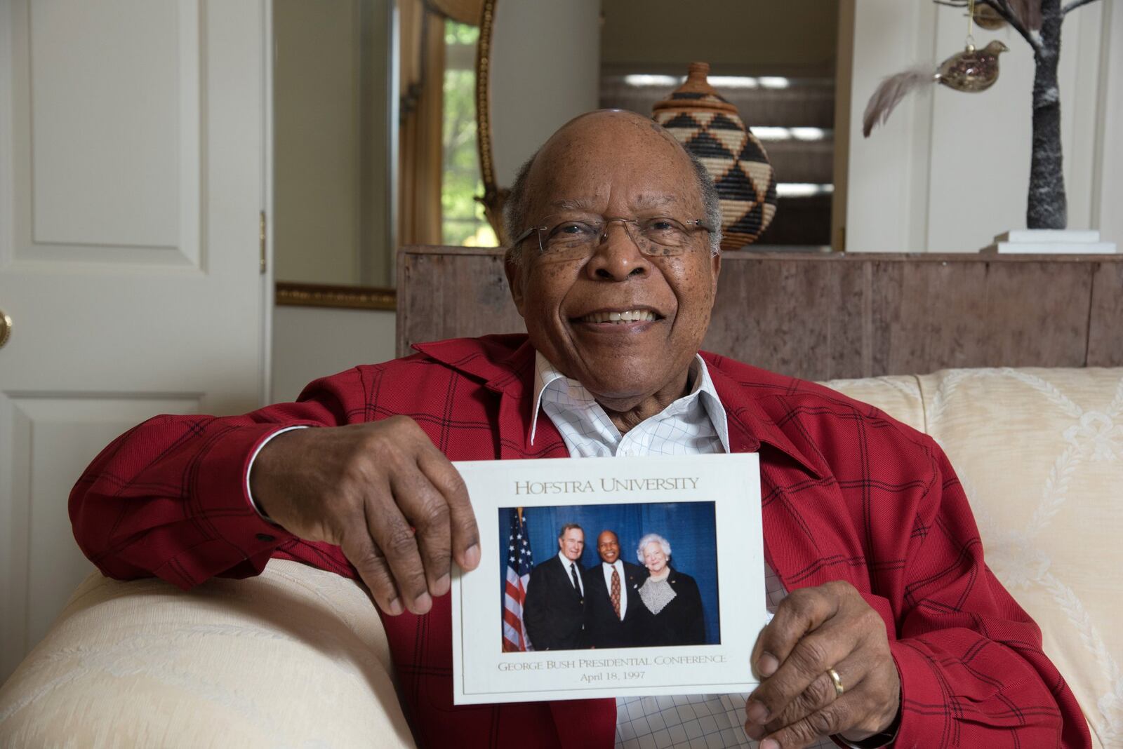 Dr. Louis Sullivan shared a photograph of himself with former President George H.W. Bush and the late Barbara Bush. AJC photo: Hyosub Shin