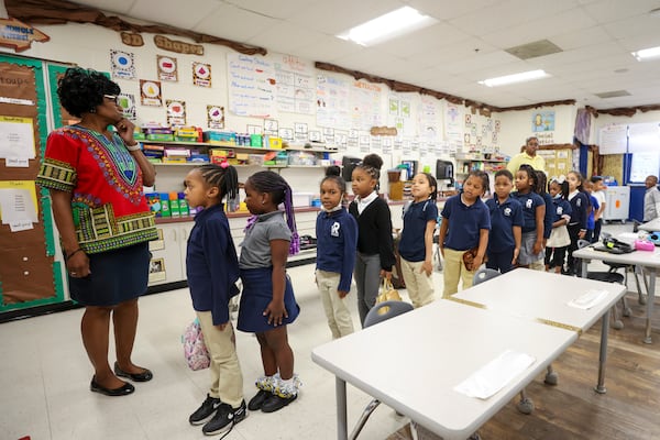 Kindergarten teacher Valerie Robinson lines up her students as they go to lunch at RISE Grammar School on Wednesday, Feb. 22, 2023, in East Point. (Jason Getz / Jason.Getz@ajc.com)