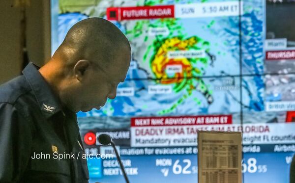 U.S. Public Health Service Capt. Charles Weir gets details on Hurricane Irma efforts early Friday at the FEMA Regional Response Coordination Center in Atlanta. (JOHN SPINK / JSPINK@AJC.COM)