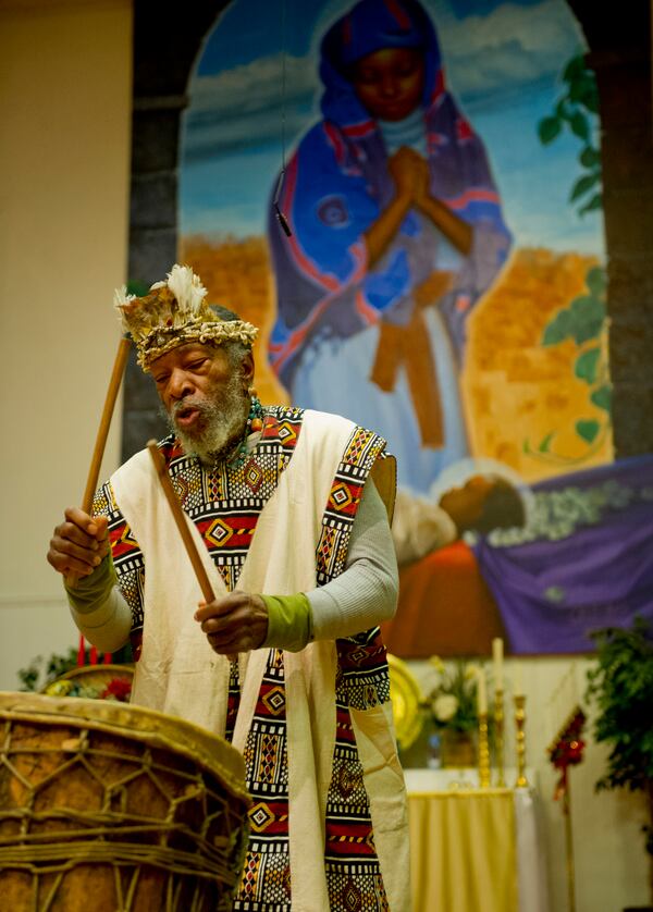 121226 Atlanta: Baba Atu plays during the drum call  at the beginning of Kwanzaa during the celebration of Umoja or Unity at the Shrine of the Black Madonna in Atlanta on Wednesday, December 26, 2012. Kwanzaa lasts seven days and celebrates different aspects of African and Carribean culture.   Jonathan Phillips Special