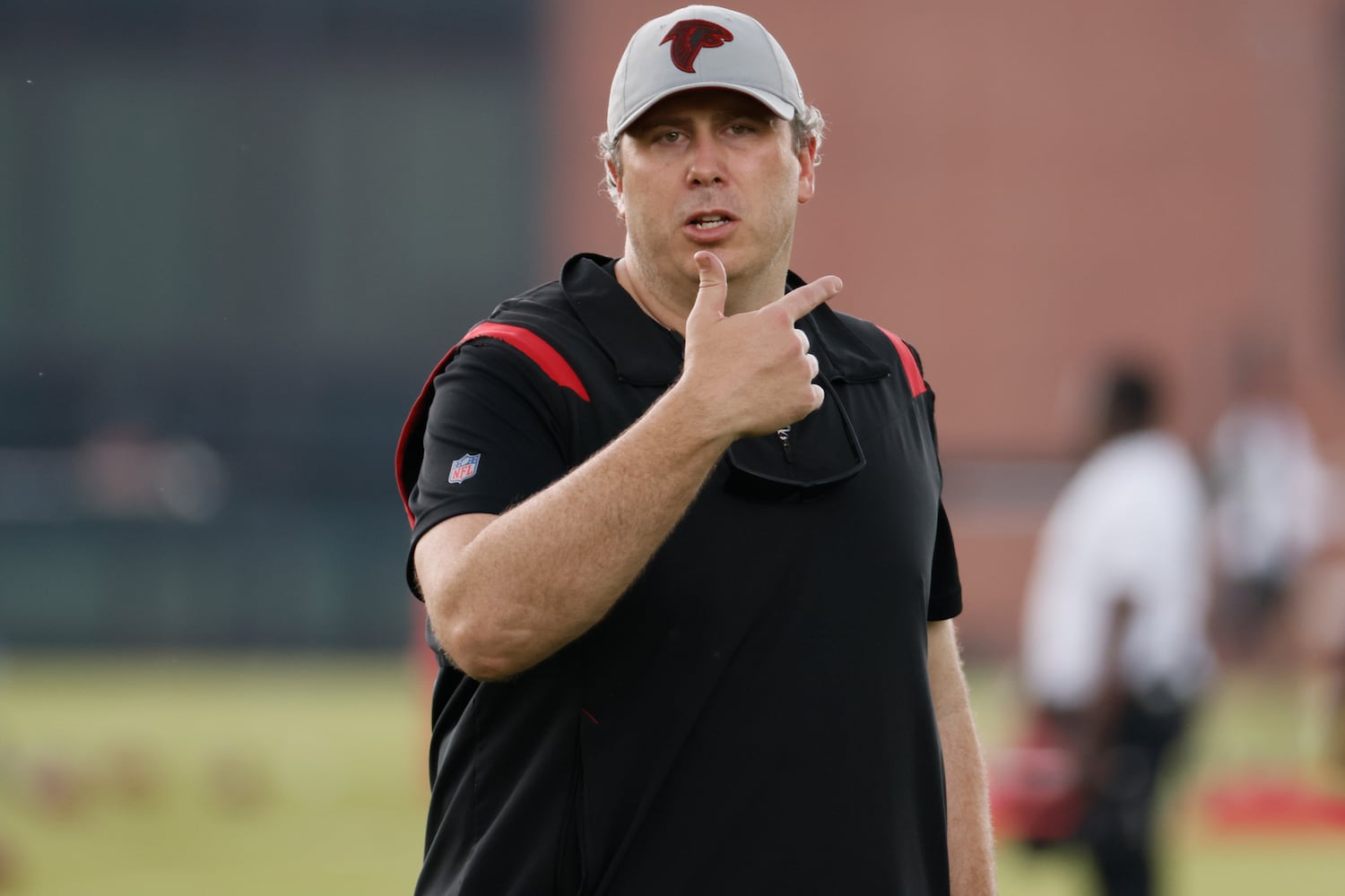 Coach Arthur Smiths stopped the practice outdoors due to a thunderstorm on Tuesday, June 14, 2022. Miguel Martinez / miguel.martinezjimenez@ajc.com