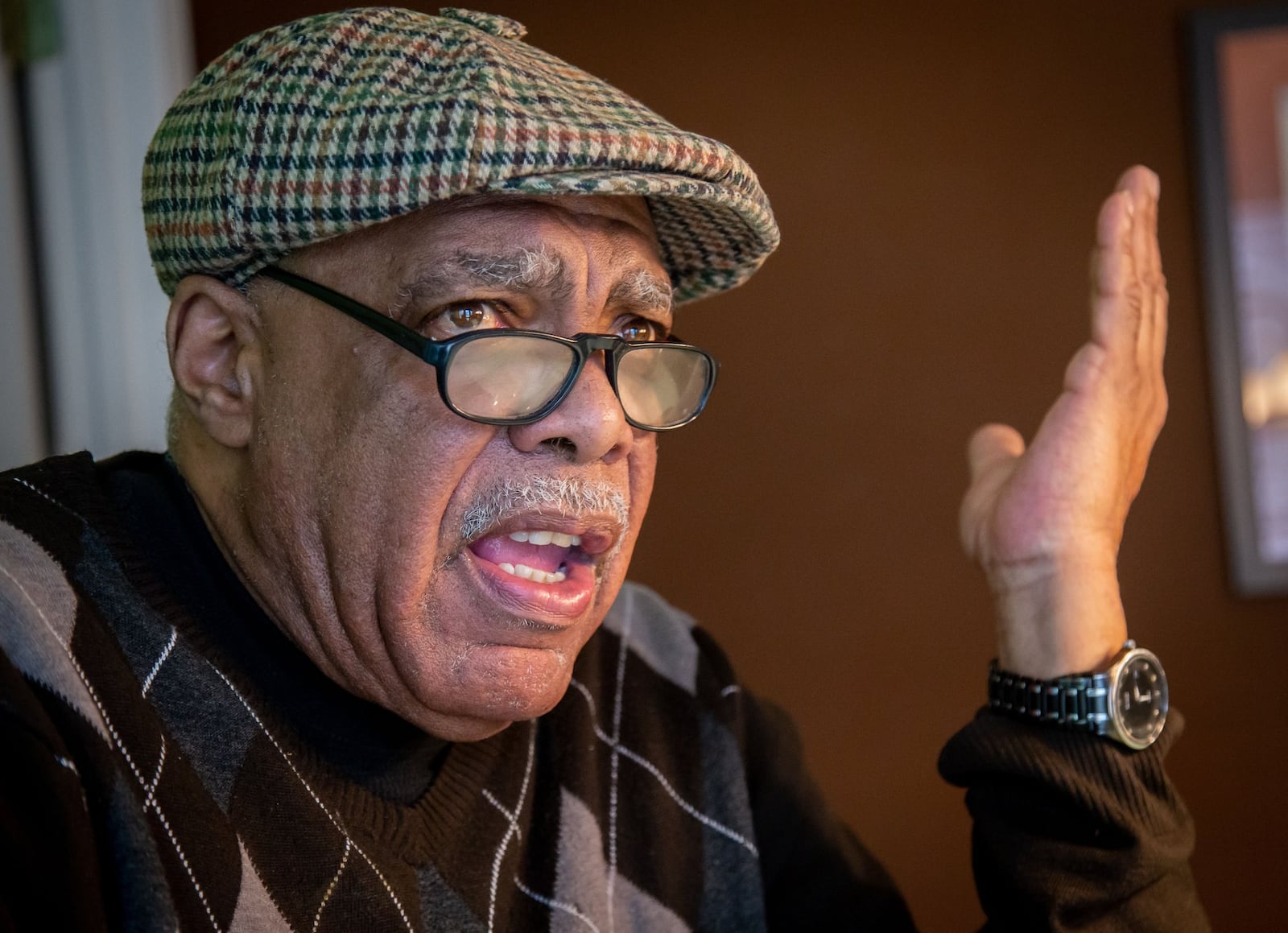 Donell Peterman talks about voter registration issues in his Union City home. STEVE SCHAEFER / SPECIAL TO THE AJC