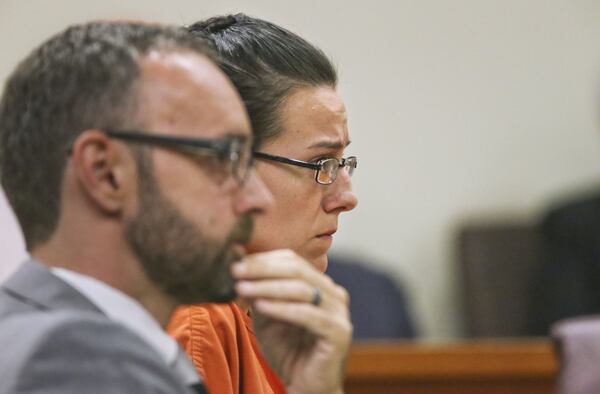 October 4, 2013 Decatur : Lawyer, Harold Buckler (left) and client/defendant, Victoria Rickman (right) listen to proceedings as she was denied bond Friday, Oct. 4, 2013 by Judge Courtney L. Johnson in DeKalb County Superior Court in Decatur. Rickman’s lawyer, Harold Buckler argued unsuccessfully that Rickman posed no threat and was a lifelong area resident. Police charged Victoria Rickman, 30, with murder and felony murder and accused her of shooting a 31-year-old male several times inside her home. The shooting happened in September on Clifton Road off Flat Shoals Road in southeast Atlanta. JOHN SPINK/JSPINK@AJC.COM