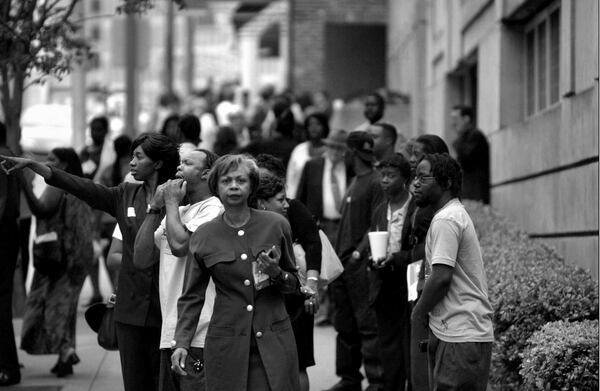 In the wake of 9/11: Workers spill out of the offices of Fulton County’s government building on Martin Luther King Boulevard this morning, one of many government
buildings evacuated today. (Louie Favorite/AJC Staff)