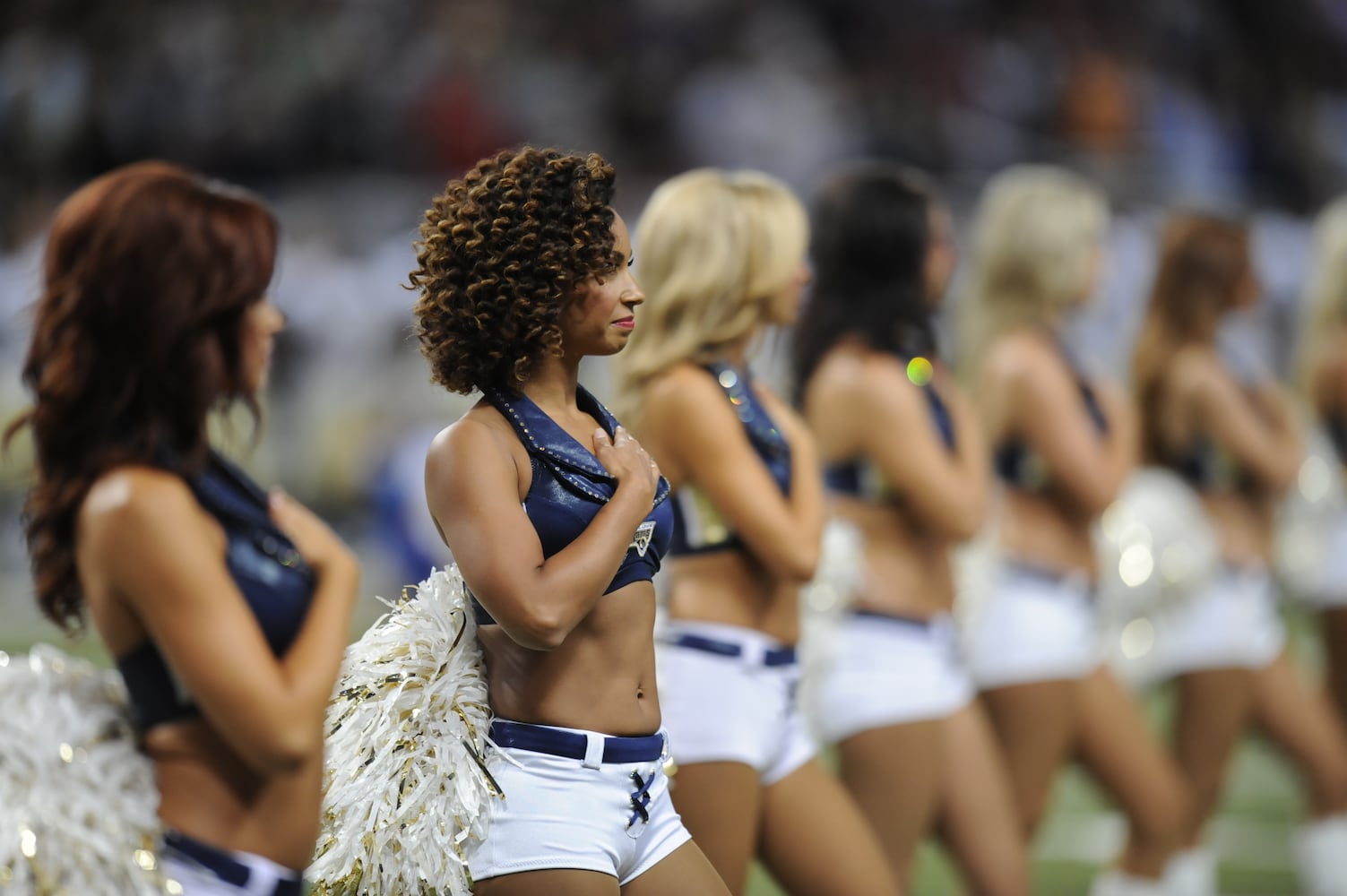 NFL cheerleaders perform at preseason games