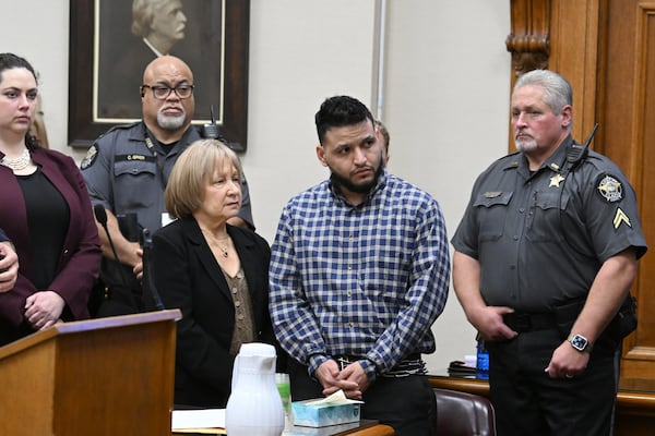 Jose Ibarra (center, standing) listens through an interpreter as his sentence is delivered.