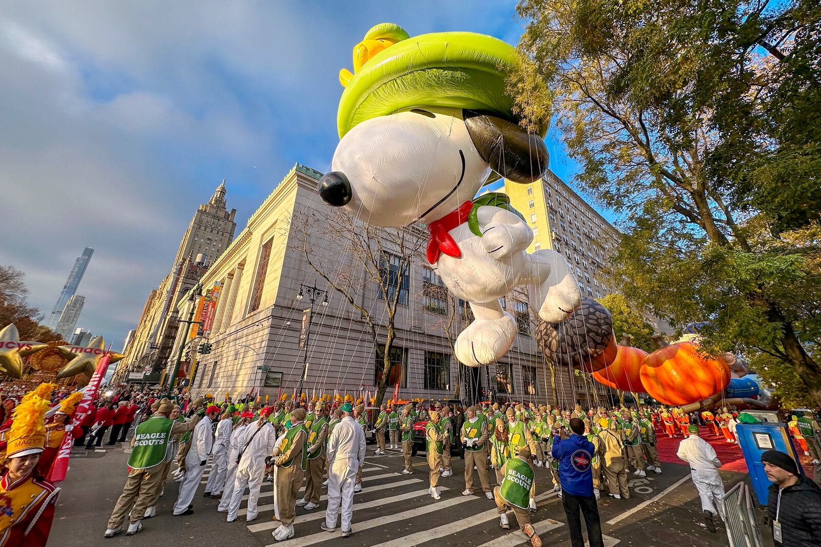 FILE - A Beagle Scout Snoopy balloon floats above Central Park West in New York during the Macy's Thanksgiving Day Parade on Thursday, Nov. 23, 2023. (AP Photo/Ted Shaffrey, File)