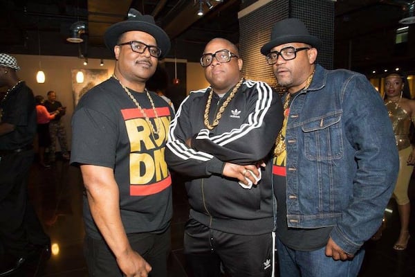 Leroy Chapman (left) and some friends at an '80s party dressed as rap group Run-DMC. 

