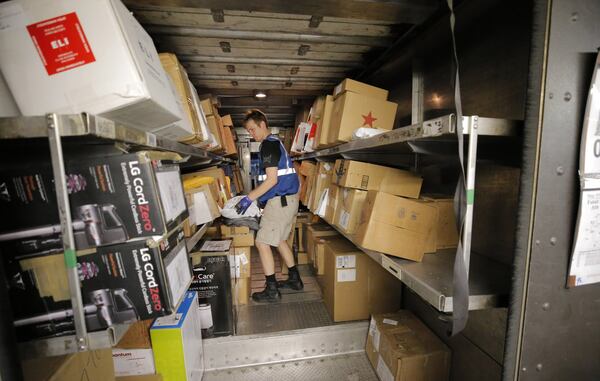 A UPS truck is preloaded in the early morning before drivers arrive. As more people buy goods online, the rapid and unrelenting expansion of e-commerce is causing real challenges for UPS. BOB ANDRES /BANDRES@AJC.COM