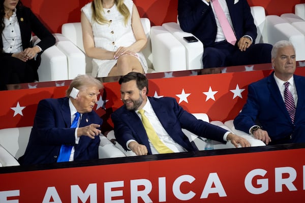 Former President Donald Trump (left) speaks with his running mate, U.S. Sen. JD Vance of Ohio, during the Republican National Convention in Milwaukee.