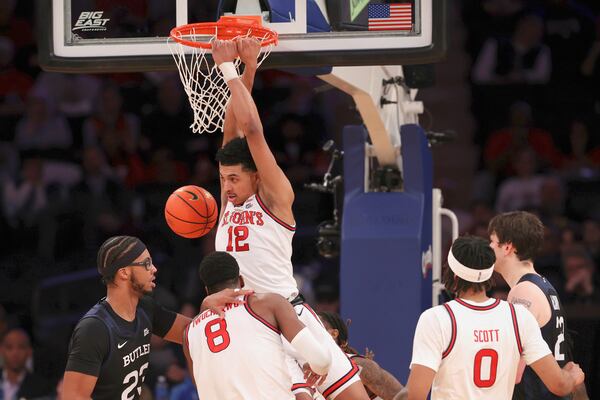 St. John's guard RJ Luis Jr. (12) dunks during the second half of an NCAA college basketball game against Butler in the quarterfinals of the Big East Conference tournament, Thursday, March 13, 2025, in New York. (AP Photo/Pamela Smith)