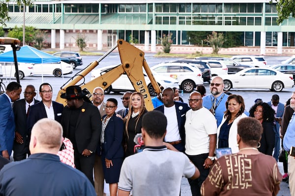 City officials and developers pose for a photo following a press conference announcing the ground breaking for an $800 million mixed used property in Clayton County on Friday, August 26, 2022.