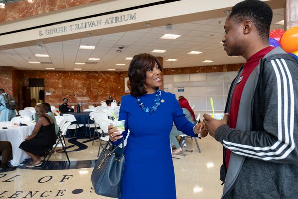 Dr. Valerie Montgomery Rice, president and CEO of the Morehouse School of Medicine, talks with first year medical student Justin Barthel on the first day of classes. (Ben Gray / Ben@BenGray.com)