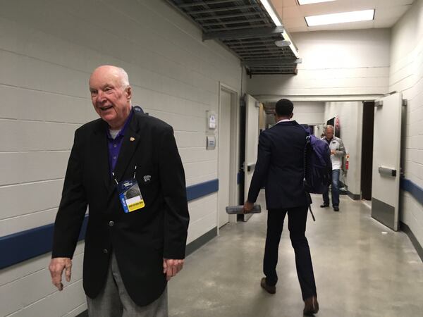 Former Kansas State basketball player and athletic director Ernie Barrett, known as "Mr. K-State" celebrated revenge over Kentucky after his team's loss in the 1951 NCAA finals to UK. Barrett is shown leaving the Kansas State locker room at Philips Arena after the Sweet 16 victory.