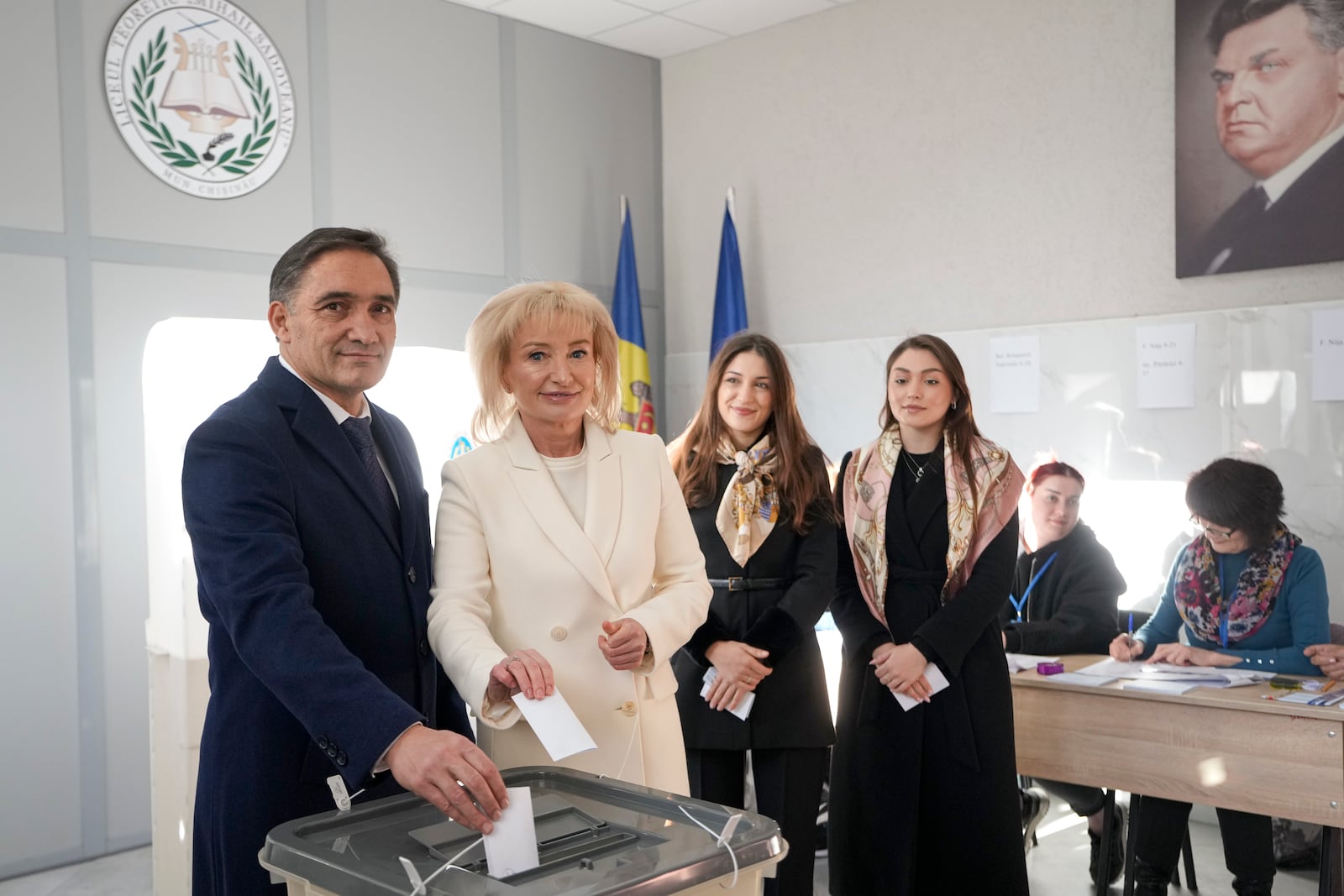 Alexandr Stoianoglo, presidential candidate of the Socialists' Party of Moldova (PSRM) and his wife Tvetana Curdova prepare to cast their votes, in Chisinau, Moldova, Sunday, Nov. 3, 2024, during a presidential election runoff. (AP Photo/Vadim Ghirda)