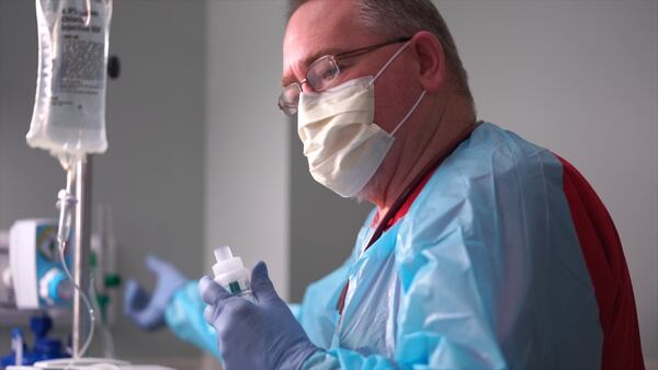 Danny McManus, a respiratory supervisor, is checking the function of a ventilator for a patient at the Hospital Authority of Miller County. (Michael Wise/The Big Picture)