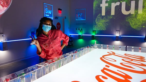 "Ambassadors" help guide visitors through a test of their sense of scent at the World of Coca-Cola. Photo: The World of Coca-Cola