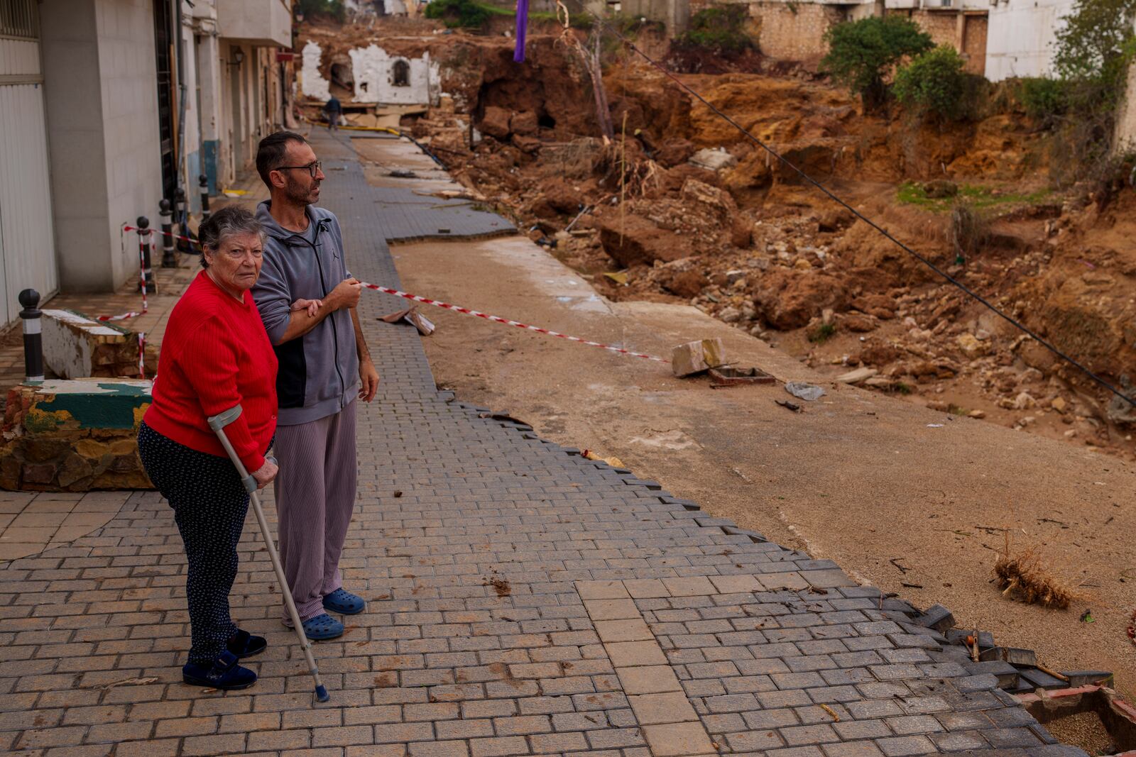 People look at an area affected by floods in Chiva, Spain, Friday, Nov. 1, 2024. (AP Photo/Manu Fernandez)