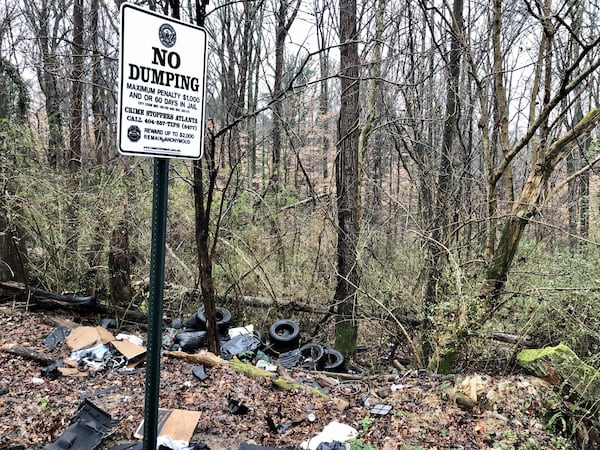 Tires and other junk have been dumped in a lot in the Carey Park neighborhood west of Midtown Atlanta. Two well-known players in Atlanta real estate planned a sweeping redevelopment in the neighborhood and others west of Midtown Atlanta. Those two speculators, Brock Built Homes President Steve Brock, and broker Gregory Todey are now gripped in a legal battle with Brock claiming Todey defrauded him of his interests in distressed land near the future Westside Park at Bellwood Quarry. J. SCOTT TRUBEY/SCOTT.TRUBEY@AJC.COM