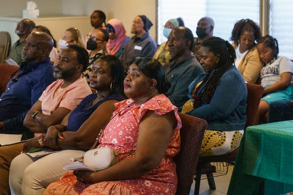 FILE - Descendants of Palm Springs Section 14 residents, front row from left, Durran Jamison, Jarvis Crawford, Janell Hunt, and Taunya Harvey gather at the United Methodist Church in Palm Springs, Calif., Sunday, April 16, 2023. (AP Photo/Damian Dovarganes, File)