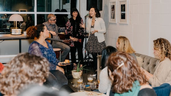 Eileen Lee, co-founder of The Lola, introduces Ruby Velle, artist and activist, during a recent gathering.