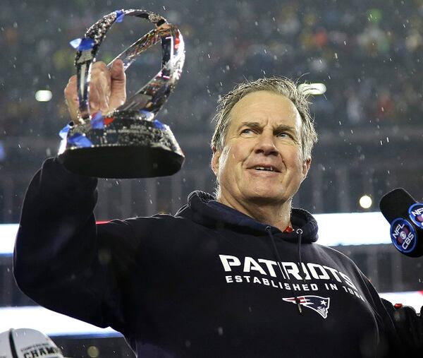 New England Patriots head coach Bill Belichick holds the championship trophy after the NFL football AFC Championship game Sunday, Jan. 18, 2015, in Foxborough, Mass. The Patriots defeated the Colts 45-7 to advance to the Super Bowl against the Seattle Seahawks. (AP Photo/Matt Slocum) Winning with honor? (Matt Slocum/AP photo)